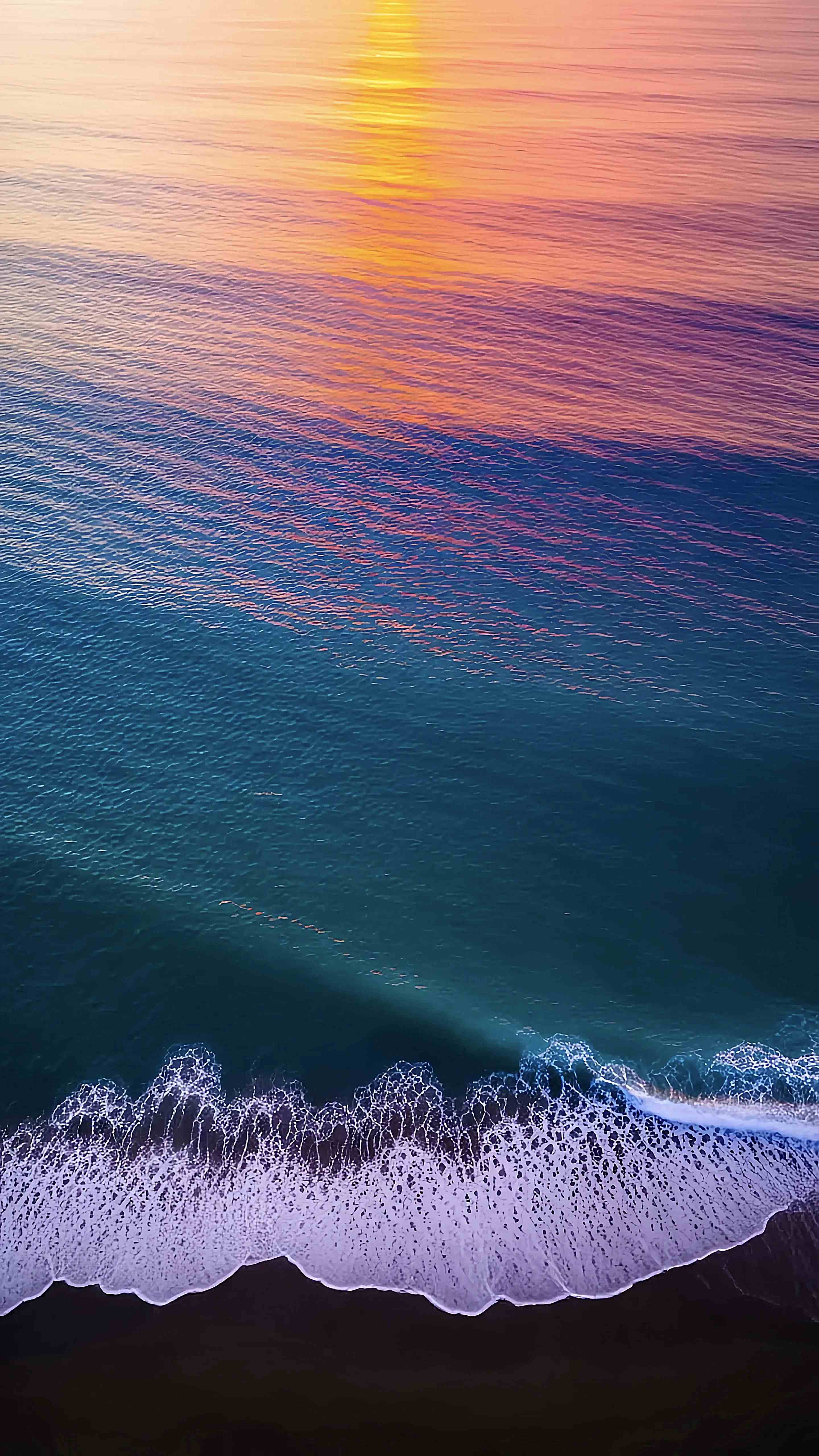 Ocean Waves Sunset Aerial View Vibrant Wallpaper 6 iphone_14_pro